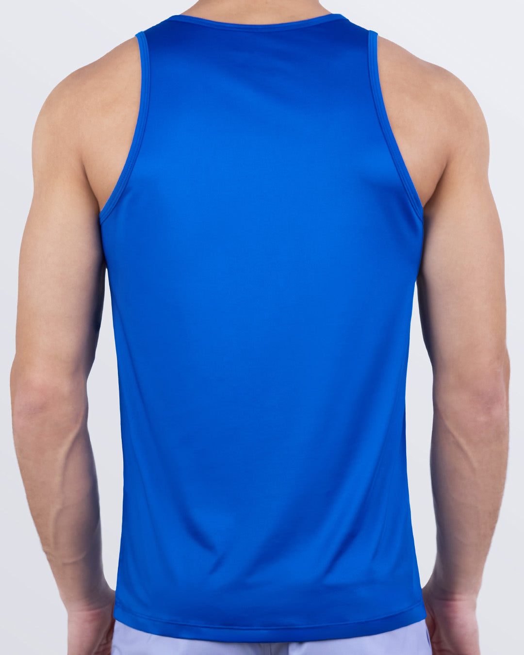 Back view of DC2 ASTRAL BLUE men's performance tank top in vibrant blue. Designed for flexibility, movement, and quick-dry comfort during workouts or active days.