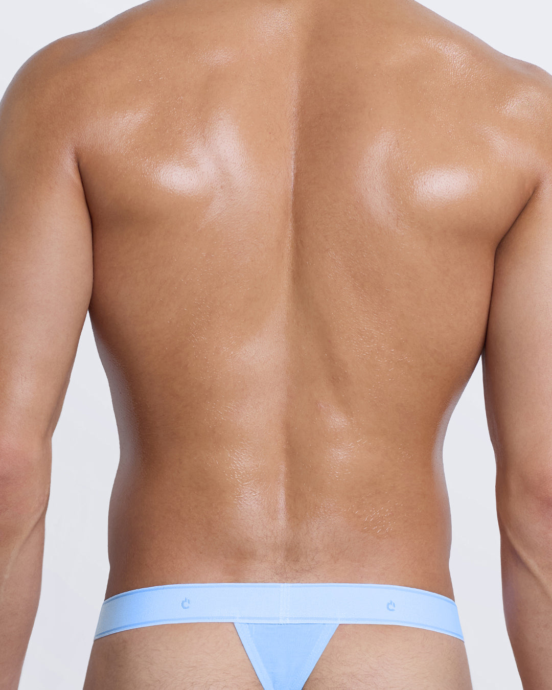 Back view of DC2 light blue cotton thong — minimal coverage with comfortable waistband fit.