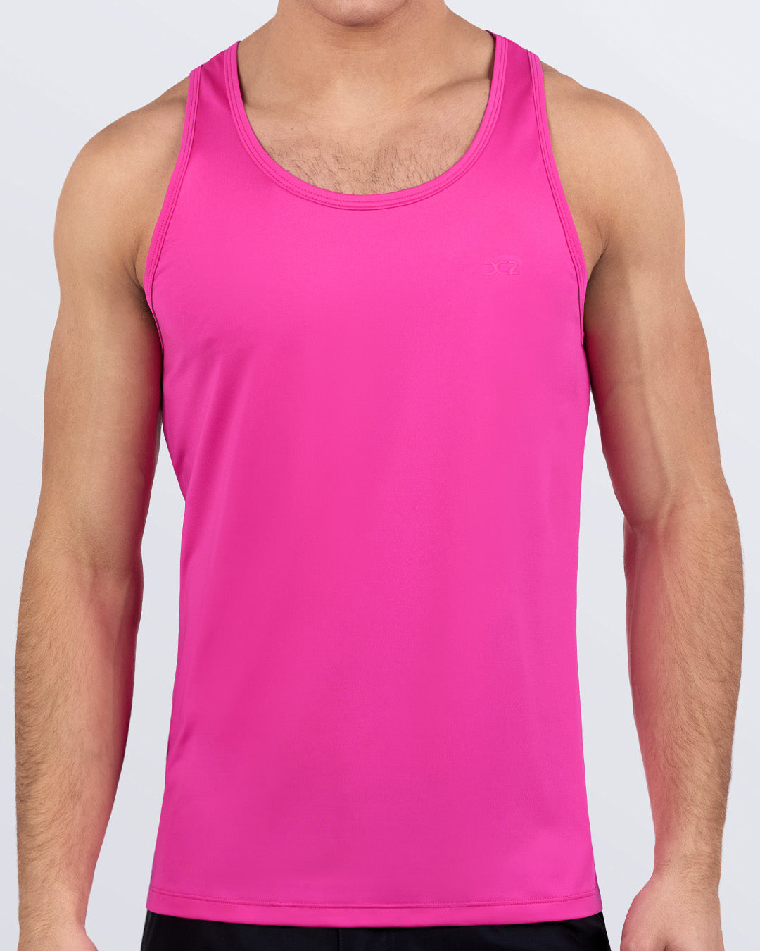 Male model wearing DC2 HOT SHOT MAGENTA gym tank top in vibrant hot pink color, perfect for workout, beach, or everyday athleisure wear.