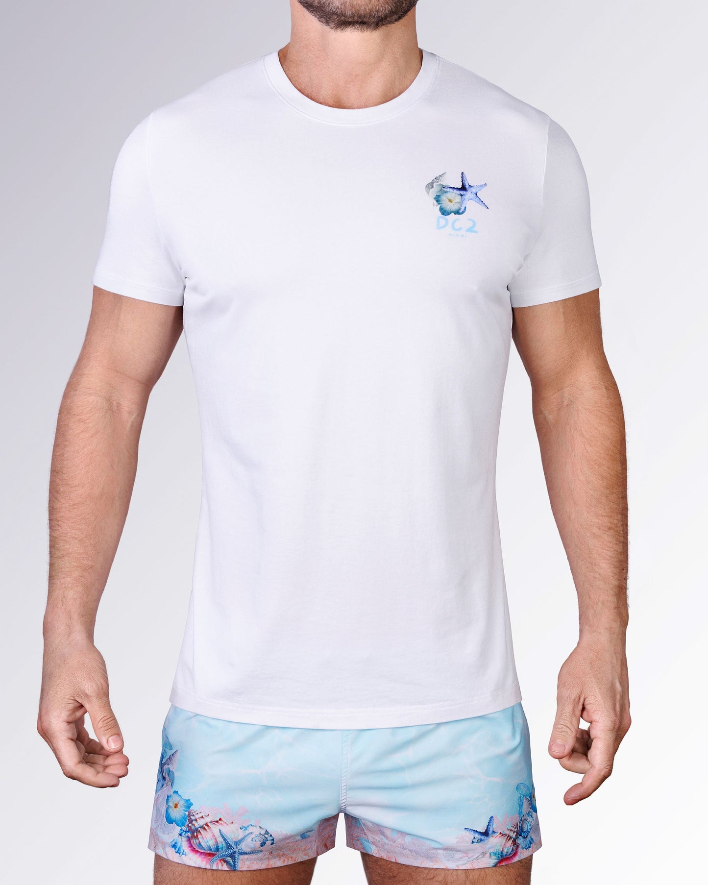 Full front view of the Coral Way Cotton Graphic T-Shirt by DC2 Miami, paired with matching pastel blue Coral Way Poolside Shorts.
