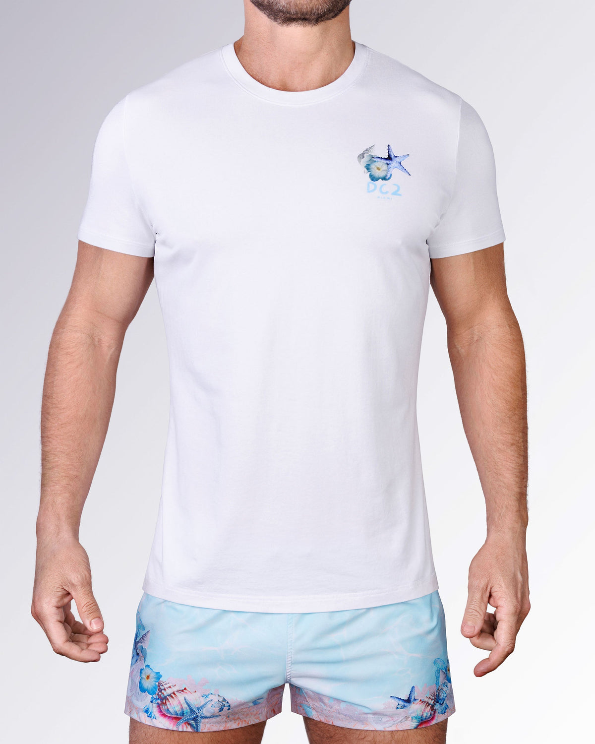 Full front view of the Coral Way Cotton Graphic T-Shirt by DC2 Miami, paired with matching pastel blue Coral Way Poolside Shorts.
