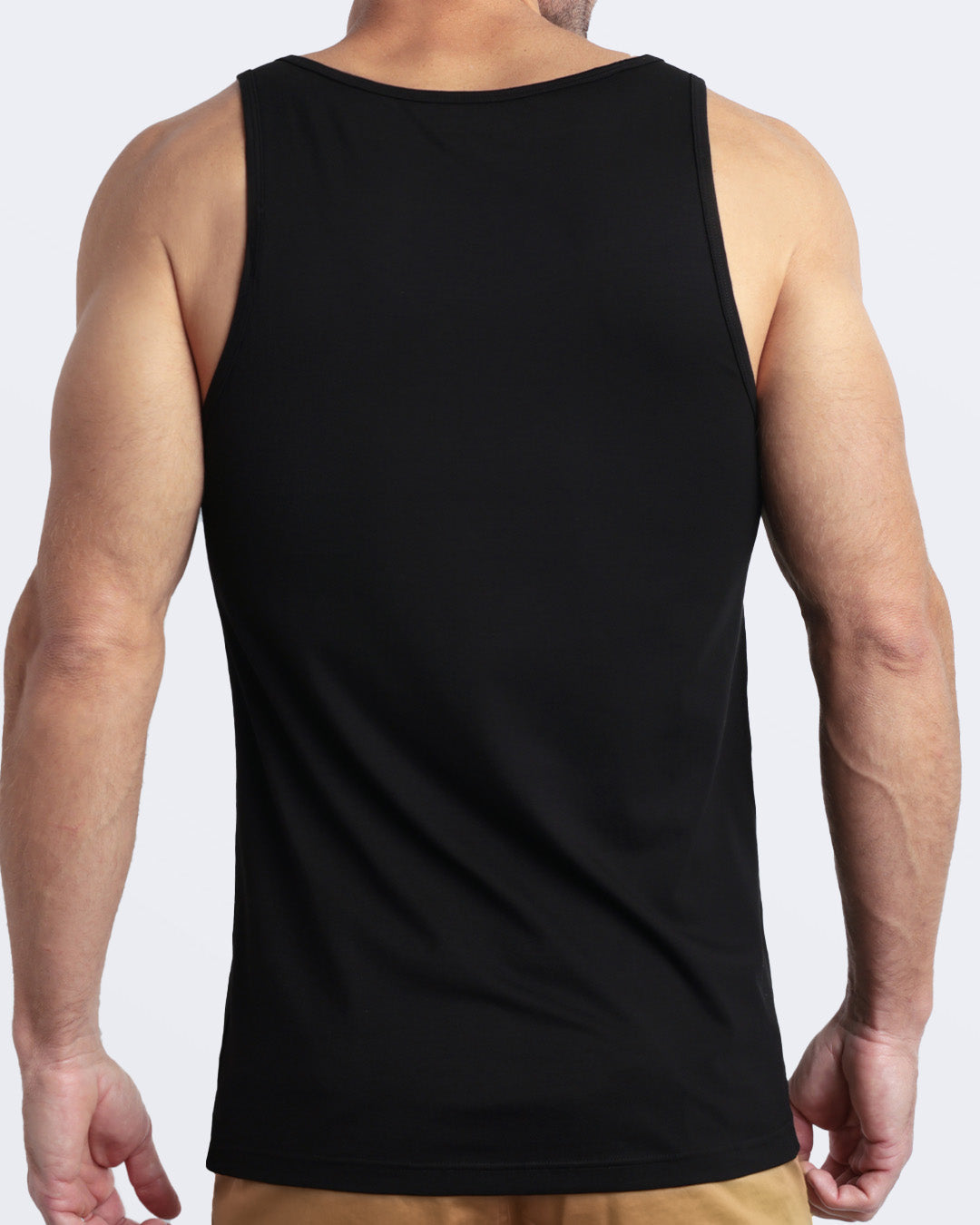 Back view of the EXACT BLACK men's fitness breathable tank top made of modal cotton blend in a solid black color by DC2 Miami menswear.