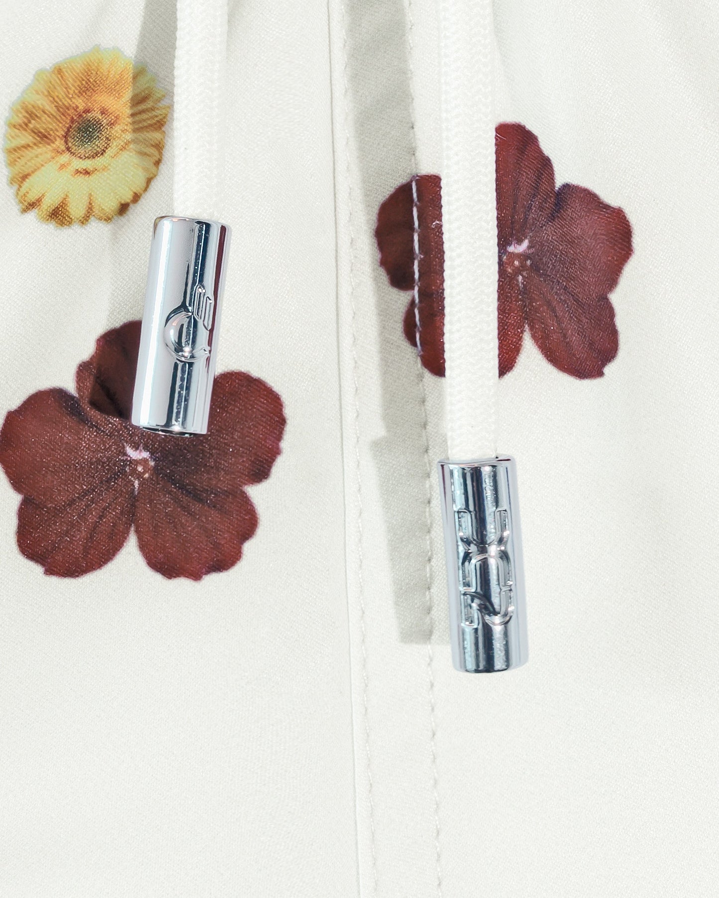 DC2 Flower Powers (Cream) Poolside Shorts — close-up of the adjustable drawstring waistband with metal-tipped cords and colorful floral pattern detail.