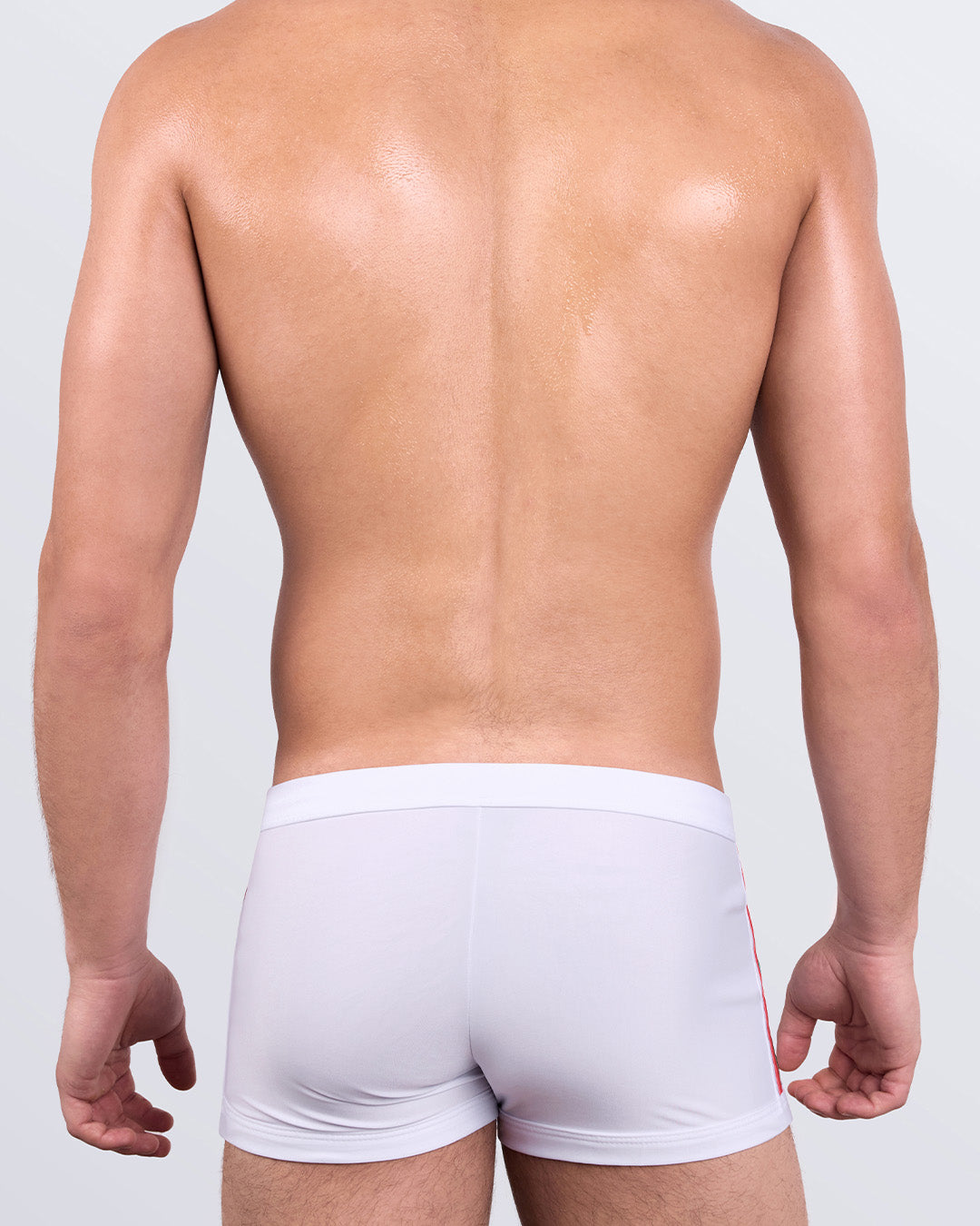 DC2 FORZA WHITE Swim Trunks — back view highlighting skin-hugging fit and seamless rear design.