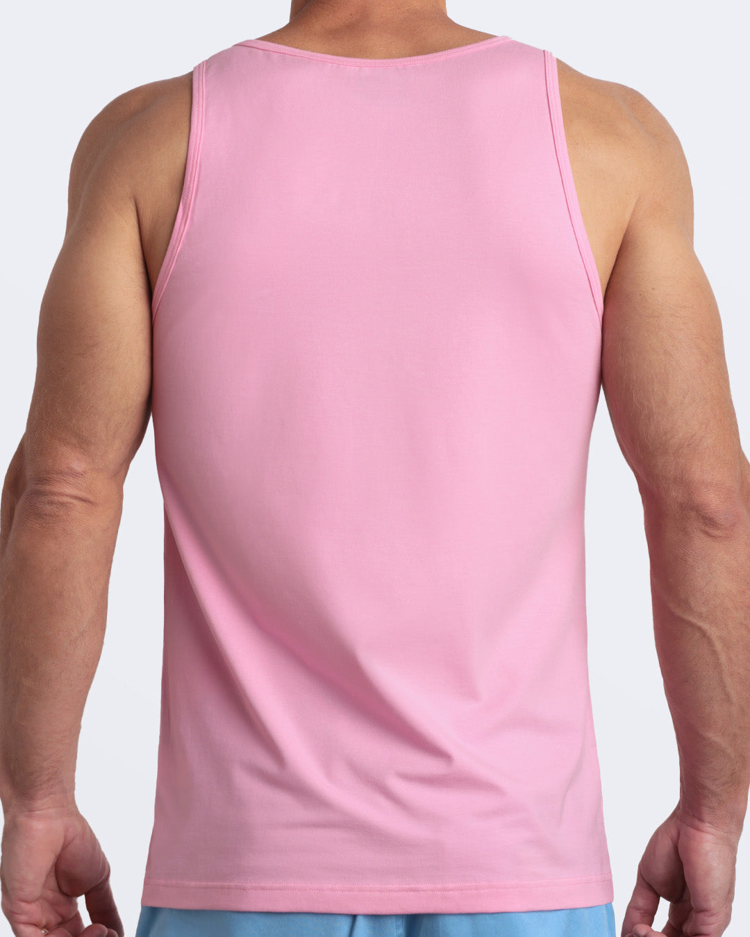 Back view of the LITERALLY PINK men's fitness breathable tank top made of modal cotton blend in a solid bubblegum pink color by DC2 Miami menswear.