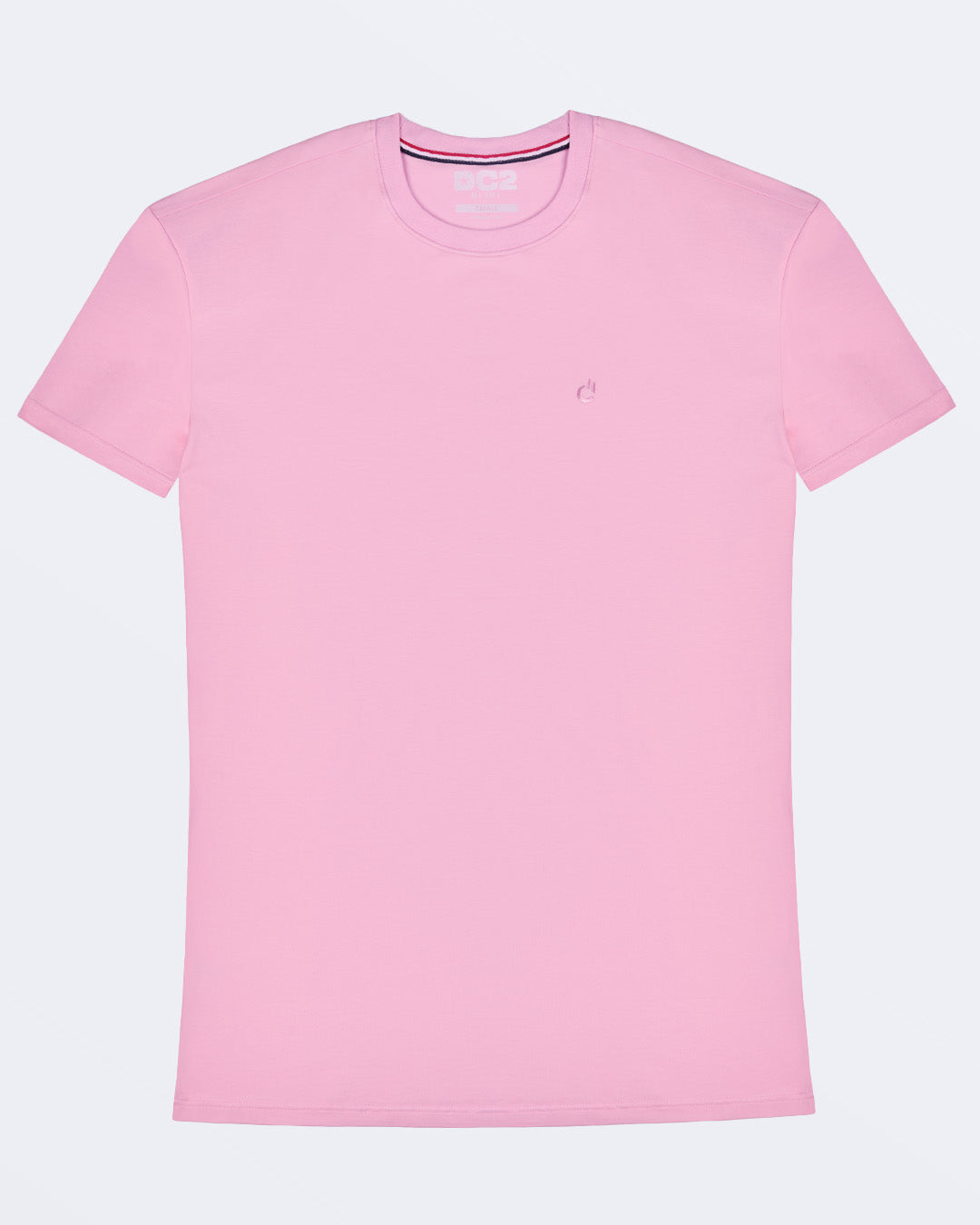Frontal view of a male model wearing a light pink color modal cotton t-shirt, crafted for stylish casual wear and beachwear by DC2 Miami. Premium quality men's streetwear t-shirt, perfect fit for summer fashion.