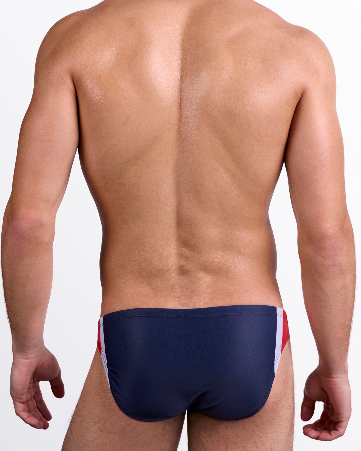 DC2 Maritime Swim Mini Brief — back view showing solid navy rear with red and white side accents.