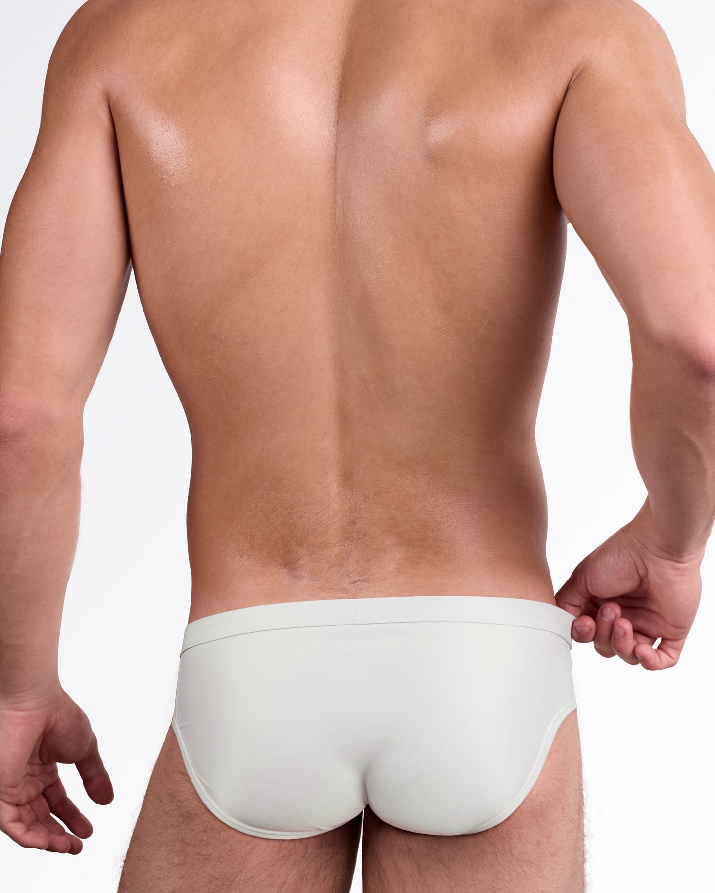 DC2 Mixtape Stripes Swim Brief — back view showing full coverage rear, smooth contouring fit, and signature multicolor stripe detailing at the hips.