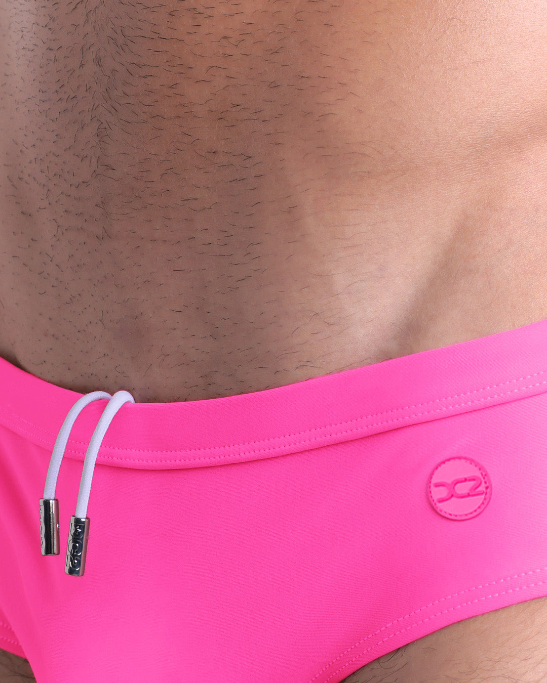 DC2 Pink Bomb Swim Brief — close-up of front waistband with drawstring detail and tonal logo.