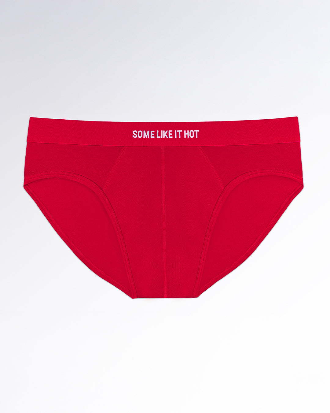 SOME LIKE IT HOT Modal Briefs — flatlay of vibrant red men’s modal briefs featuring a contoured pouch and bold elastic waistband with white text detailing.