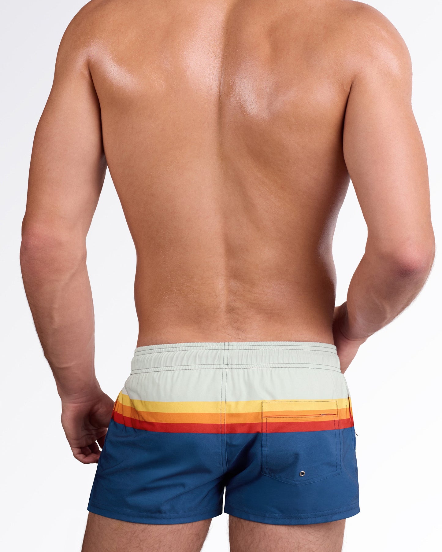 DC2 Sunset Stripes Poolside Shorts — back view highlighting the horizontal sunset stripe pattern and rear pocket detail on the blue swim shorts.