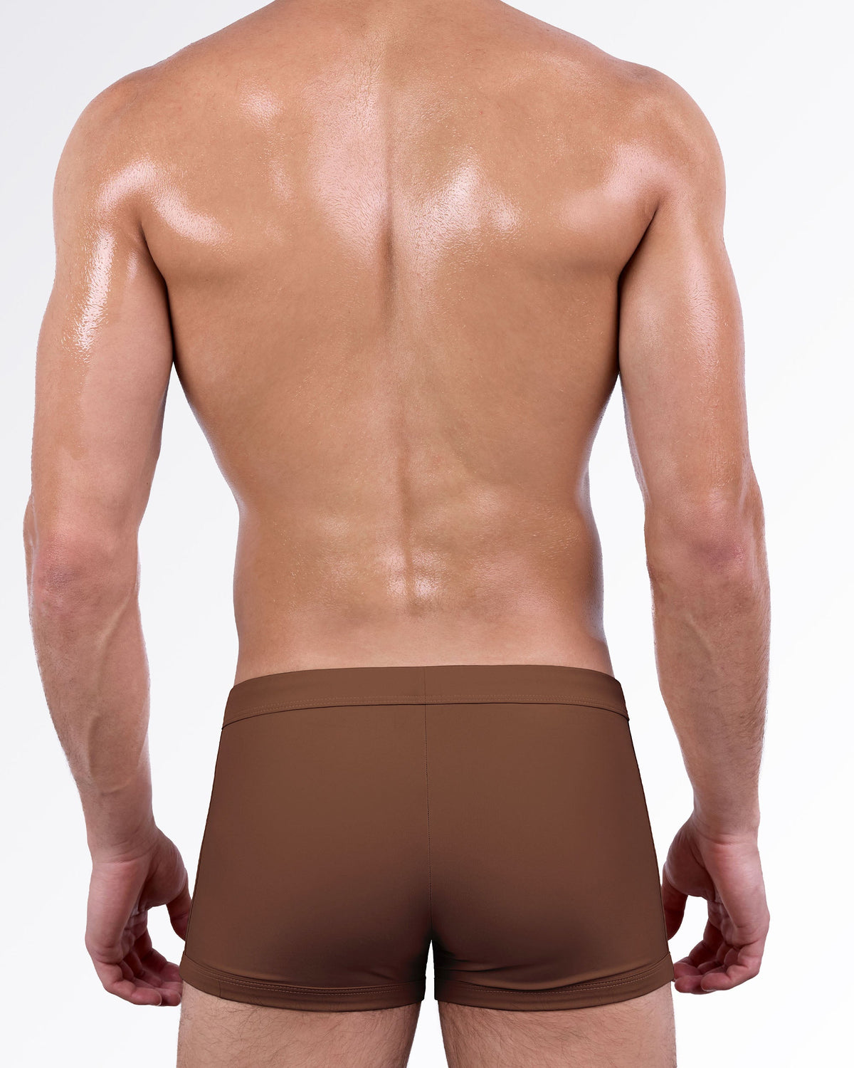 Back view of the That’s That Me Espresso Swim Trunk showcasing a sleek espresso brown finish, streamlined fit, and comfortable full-coverage men's swimsuit.
