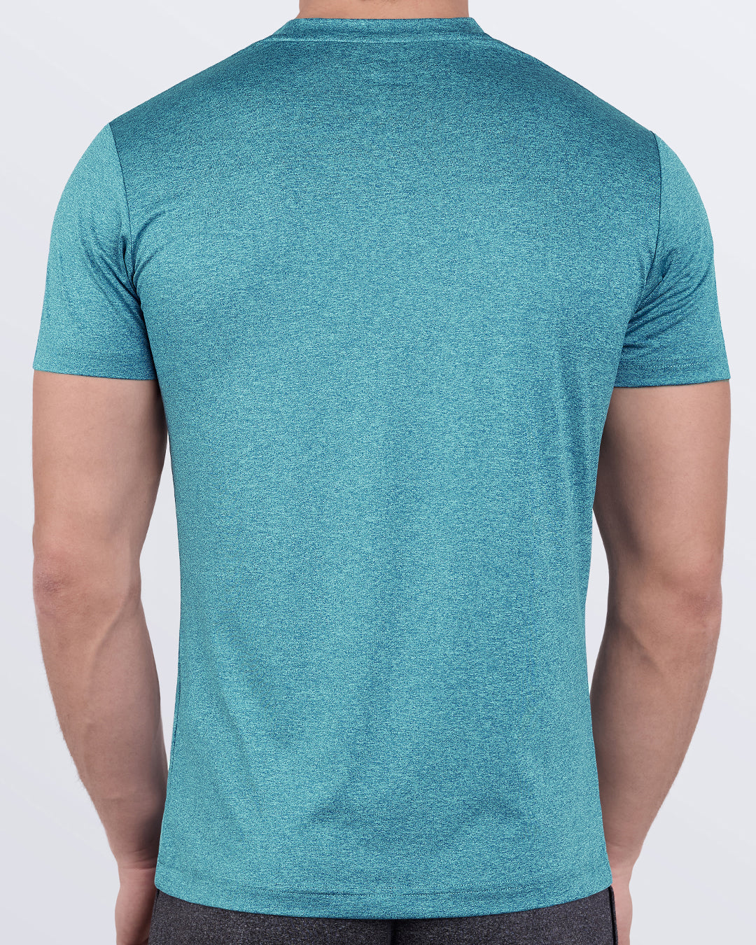 DC2 Trainer Teal Fitness T-Shirt — back view highlighting moisture-wicking quick-dry fabric and muscle-accentuating fit.