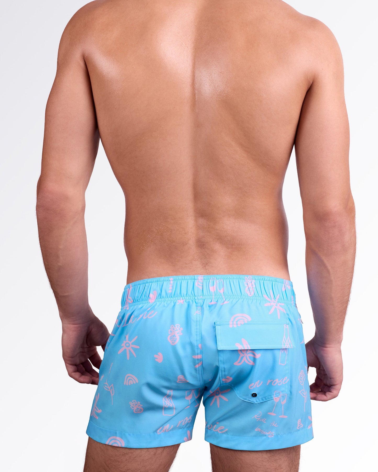 DC2 Miami Viva La Vida (En Rose) Flex Shorts — back view highlighting elastic waistband, rear pocket detail, and all-over pink illustration print on smooth quick-dry fabric.