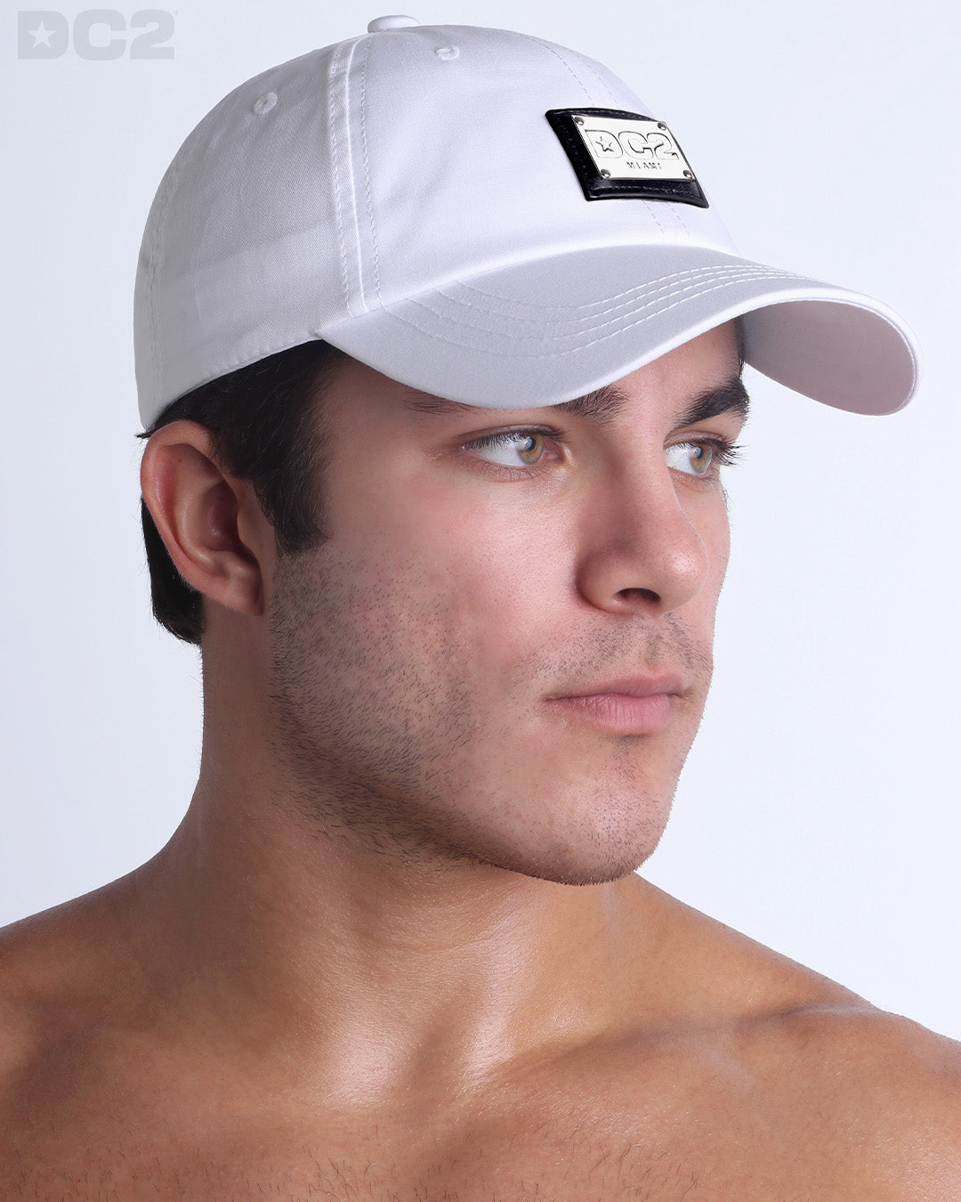 Side view of the Chillax Cap in WHITE, a solid white color, features ventilation eyelets on the cap to provide extra breathability, perfect for active wear.