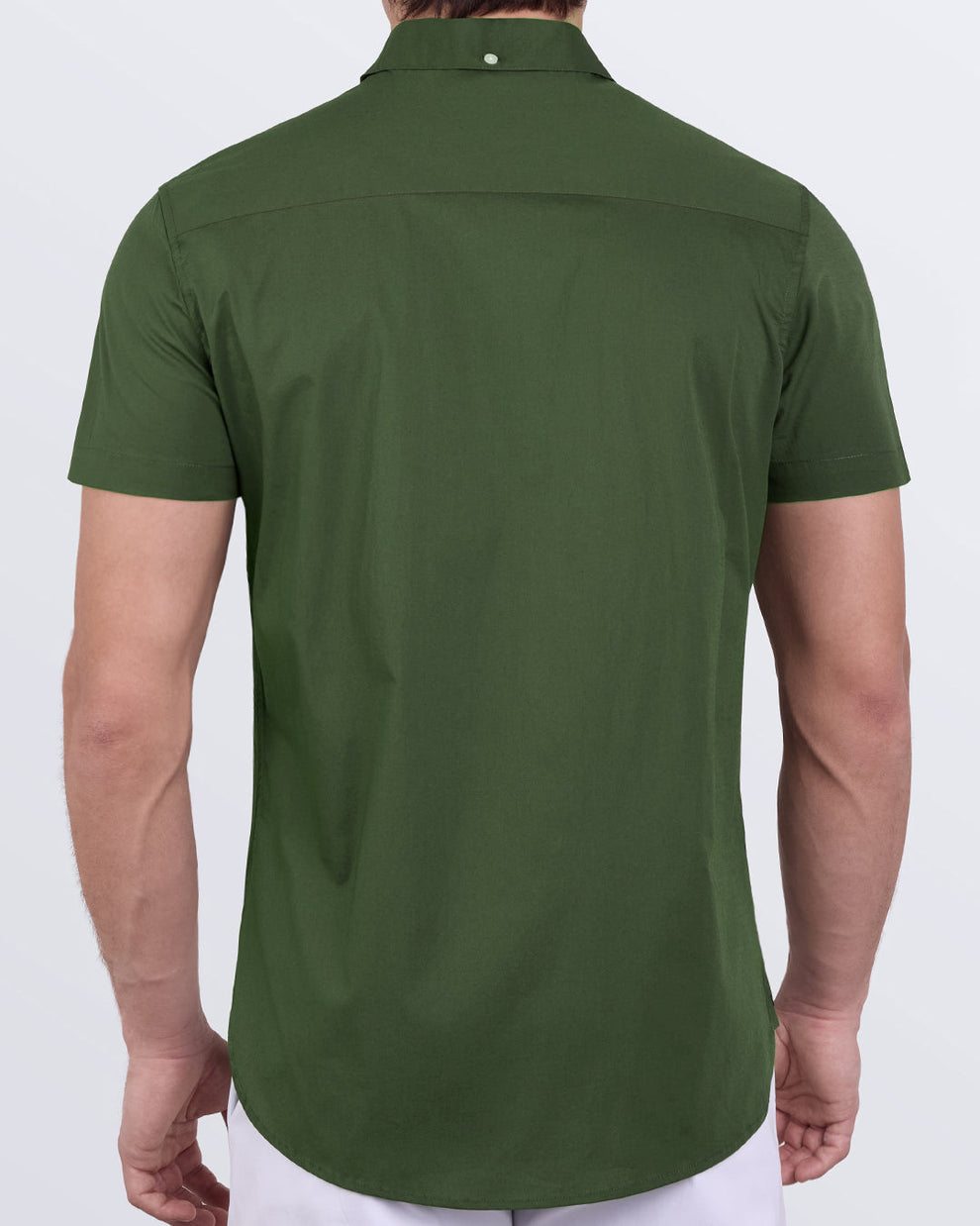 Back view of Alpha Green cotton shirt showing tailored fit and curved hem in soft elastic poplin.
