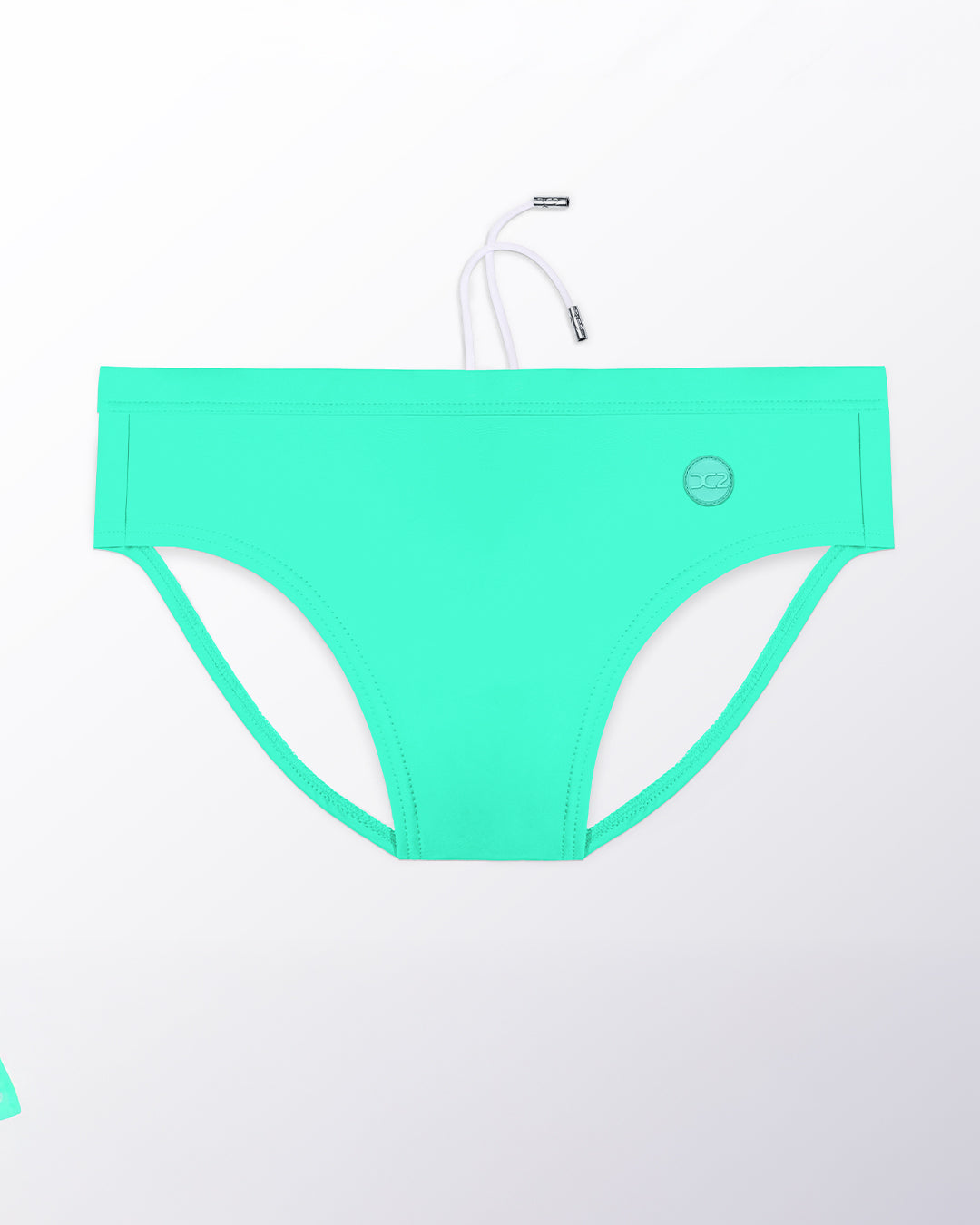 Flat lay of the DC2 Aqua Glow Swim Brief, featuring a luminous aqua tone and sleek, sculpted swim brief design.