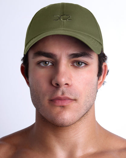 DC2 Resort Cap in army green worn by model, minimalist structured baseball cap with tonal embroidered logo.