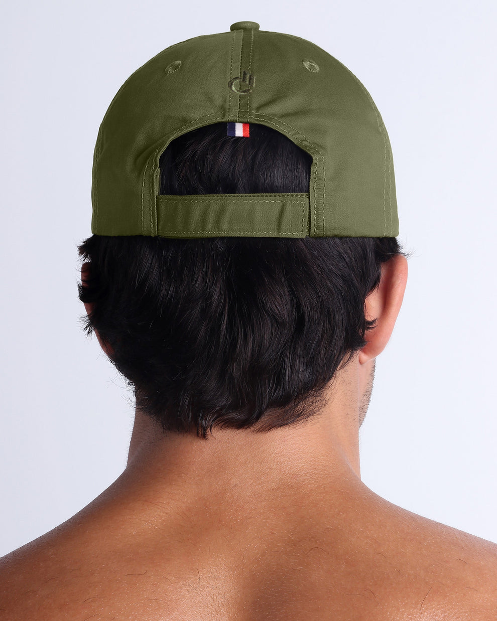 Back view of DC2 army green resort cap, adjustable strap detail and clean modern finish.