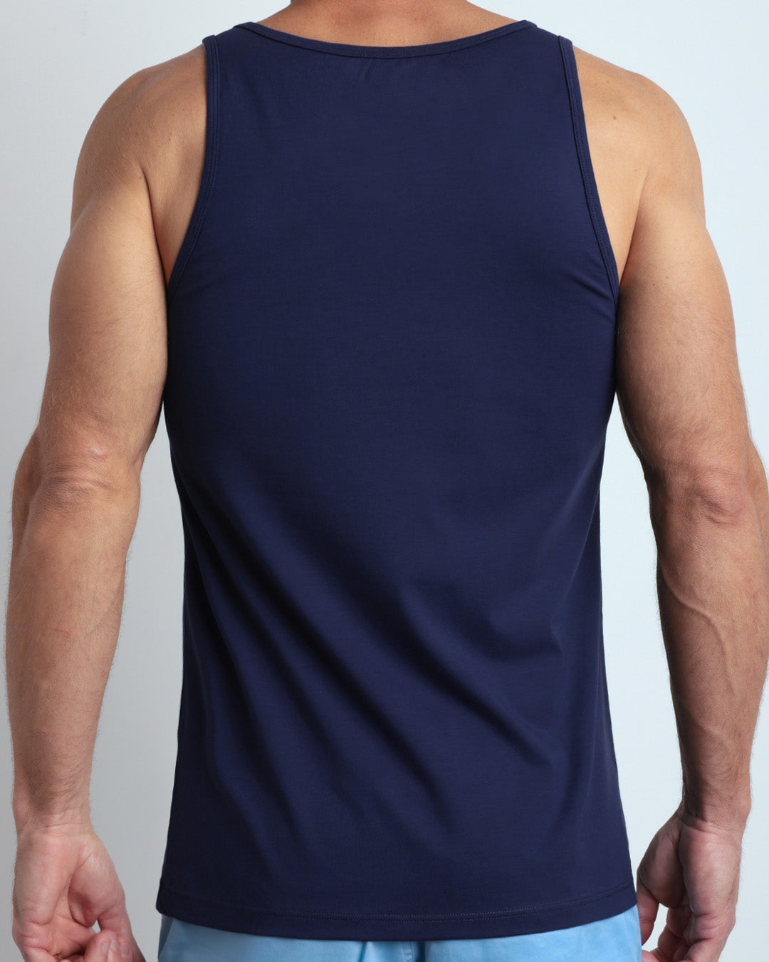 Back view of the BE MY NAVY men's fitness breathable tank top made of modal cotton blend in a solid dark navy blue color by DC2 Miami menswear.