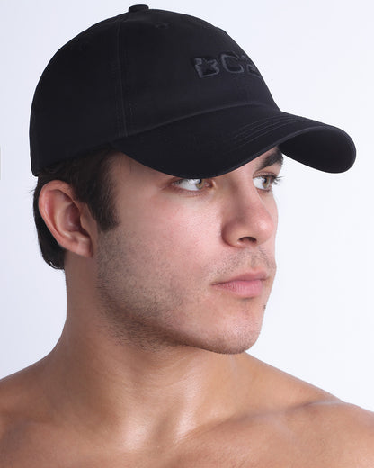 Side view of the Chillax Cap in BLACK,  a dark black color, features ventilation eyelets on the cap to provide extra breathability, perfect for active wear.