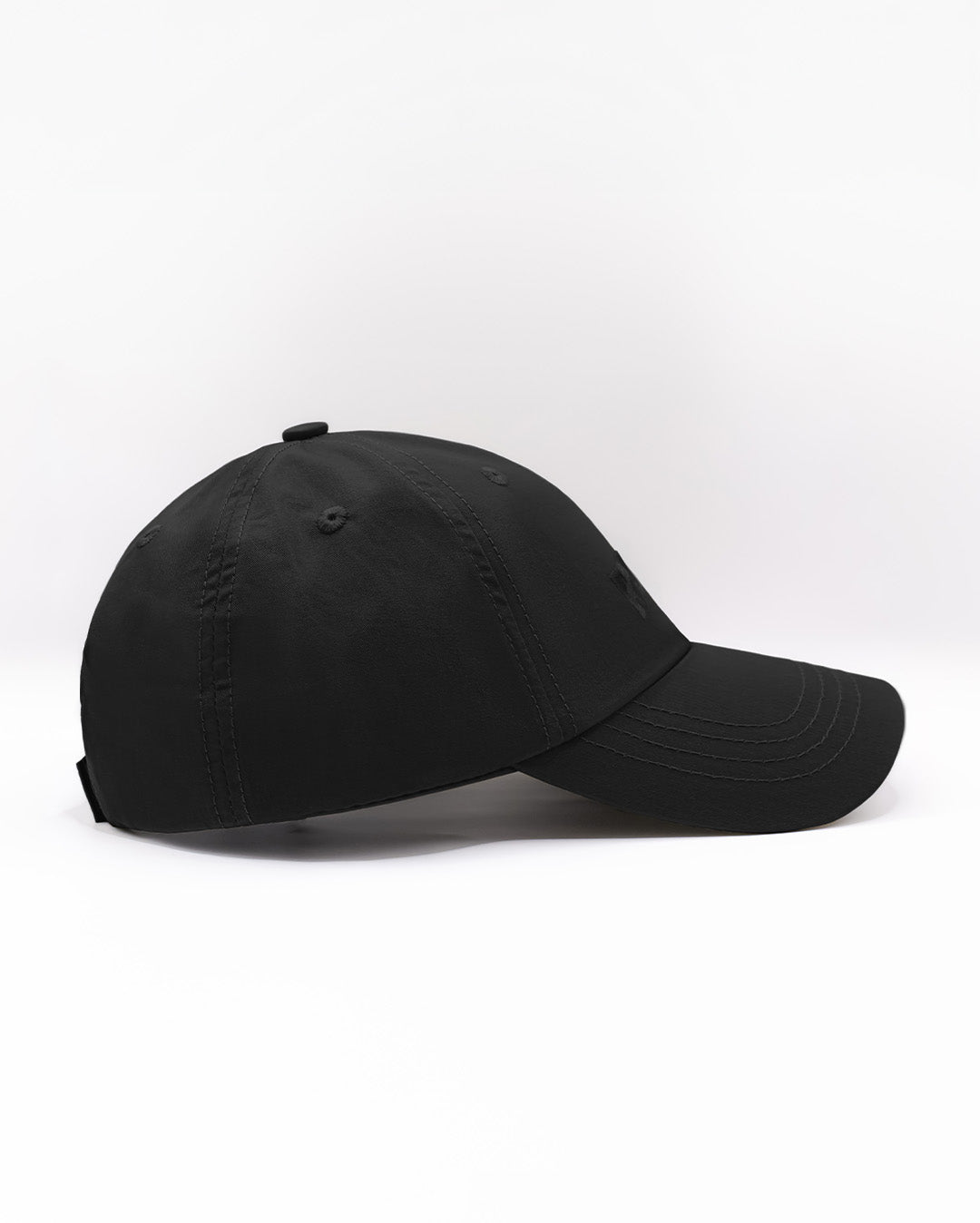 Angled view of the BLACK Chillax Cap, featuring a sleek and minimalist design in solid black. The cap is made from high-quality fabric, with a curved brim and subtle stitched logo from DC2 Miami on the front panel.