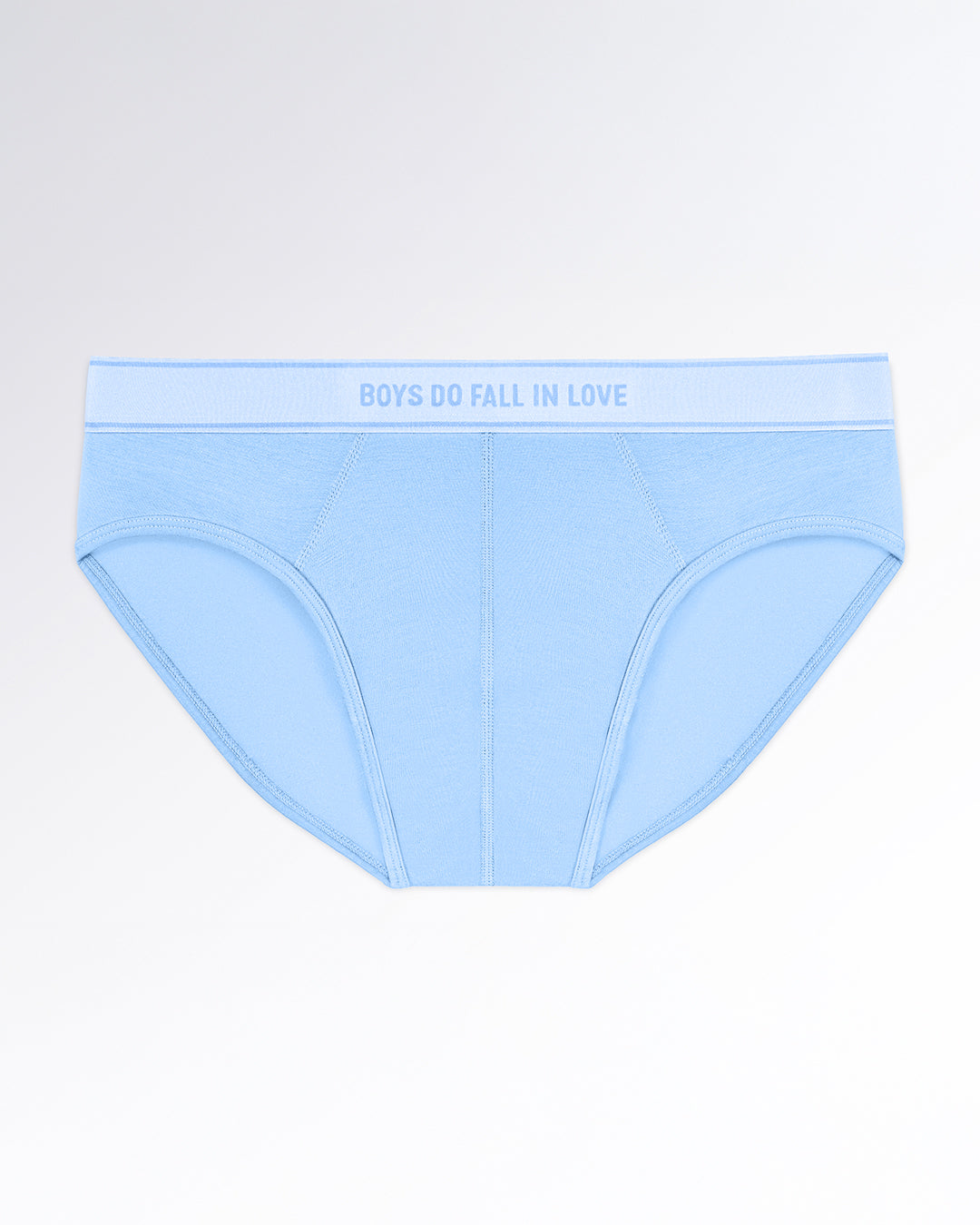 BOYS DO FALL IN LOVE Modal Briefs — flatlay of light blue men’s modal briefs with soft contour stitching and a matching elastic waistband featuring tonal text.
