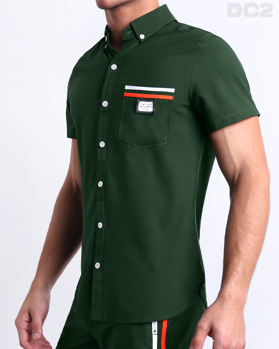 Side view of the BRAVE GREEN Hawaiian-inspired Stretch Shirt for men features a in a solid green color, complete with a front pocket, made by DC2 a capsule brand by BANG! Clothes in Miami.