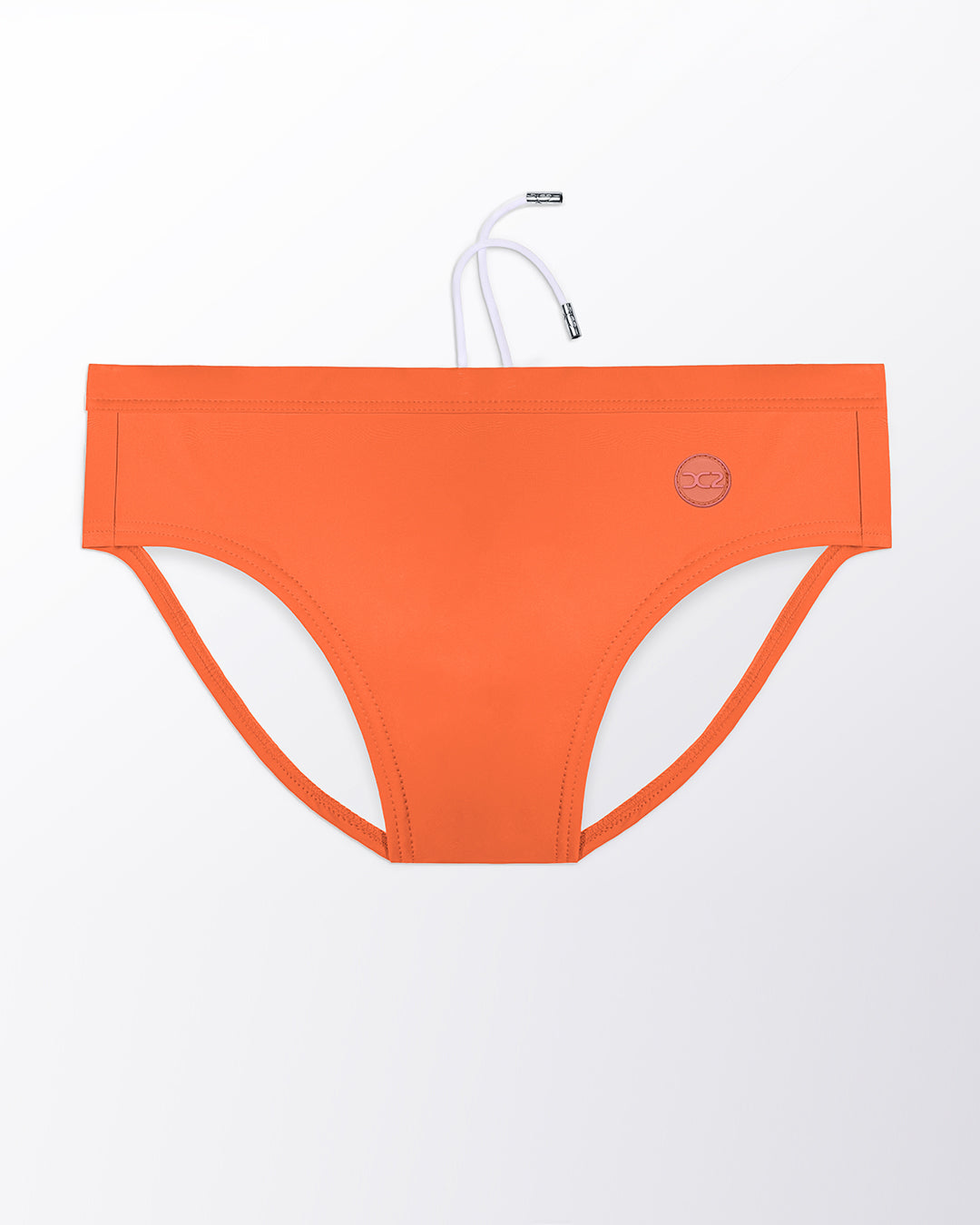 Flat lay of the DC2 Bronze Factor Swim Brief, featuring a warm bronze tone and sleek, sculpted swim brief design.