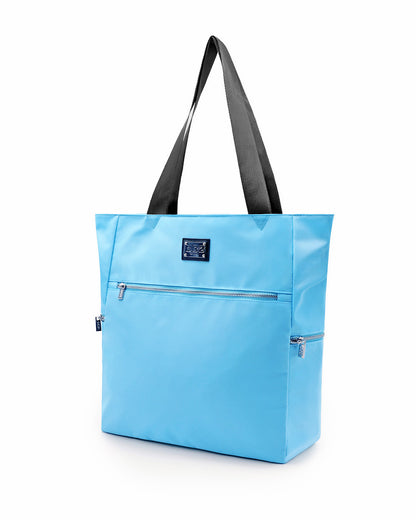 The COASTAL BLUE Poolside Tote Bag by DC2 Miami, features a solid sky blue color. This bag is a perfect companion for beach outings, shopping trips, or everyday use.