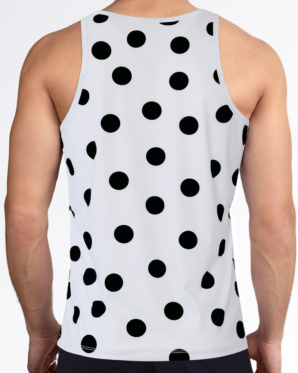 Men’s workout tank top with racerback-style cut, allover black dot print, white performance fabric, and sleeveless fit.
