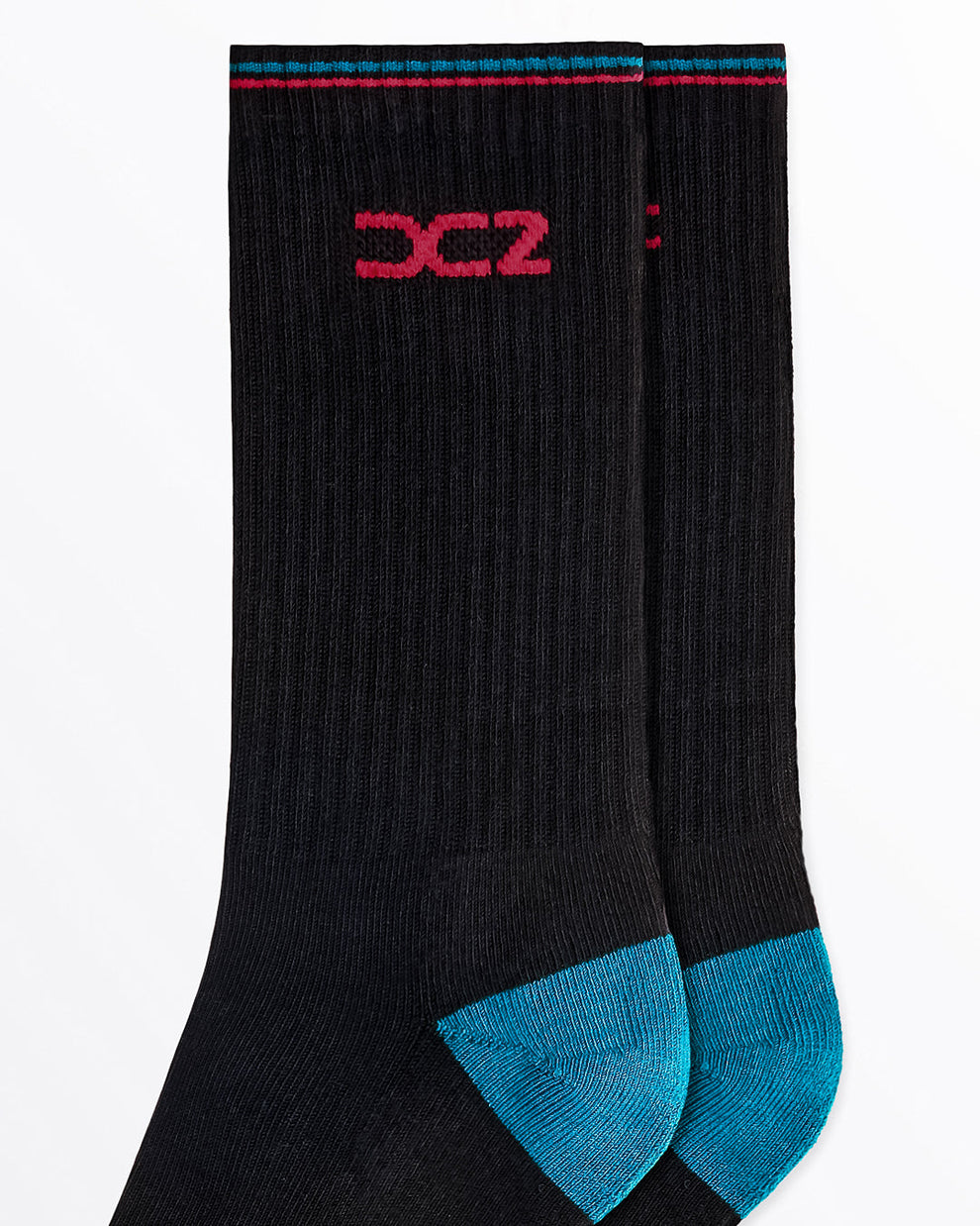 DC2 Daily Ribbed Crew Socks (Black + Teal) — close-up of ribbed knit texture, teal heel detail, and red DC2 logo on cuff.