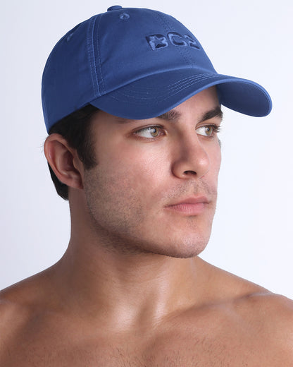 Side view of the Chillax Cap in DENIM BLUE,  a dark blue color, features ventilation eyelets on the cap to provide extra breathability, perfect for active wear.