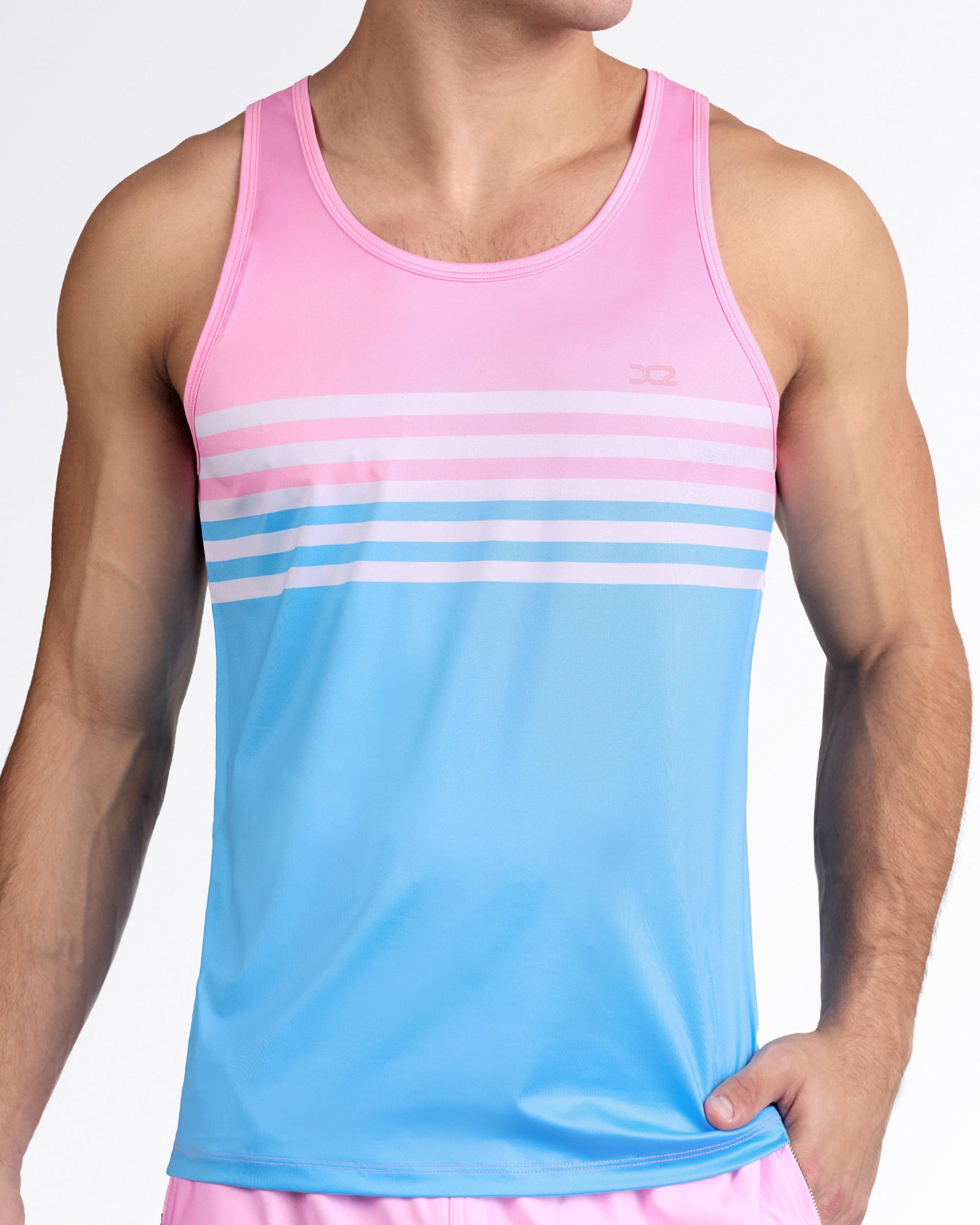 DC2 Equinox Pastels Gym Tank Top — model wearing pink-to-blue gradient men’s tank with horizontal pastel stripe detail across the chest.