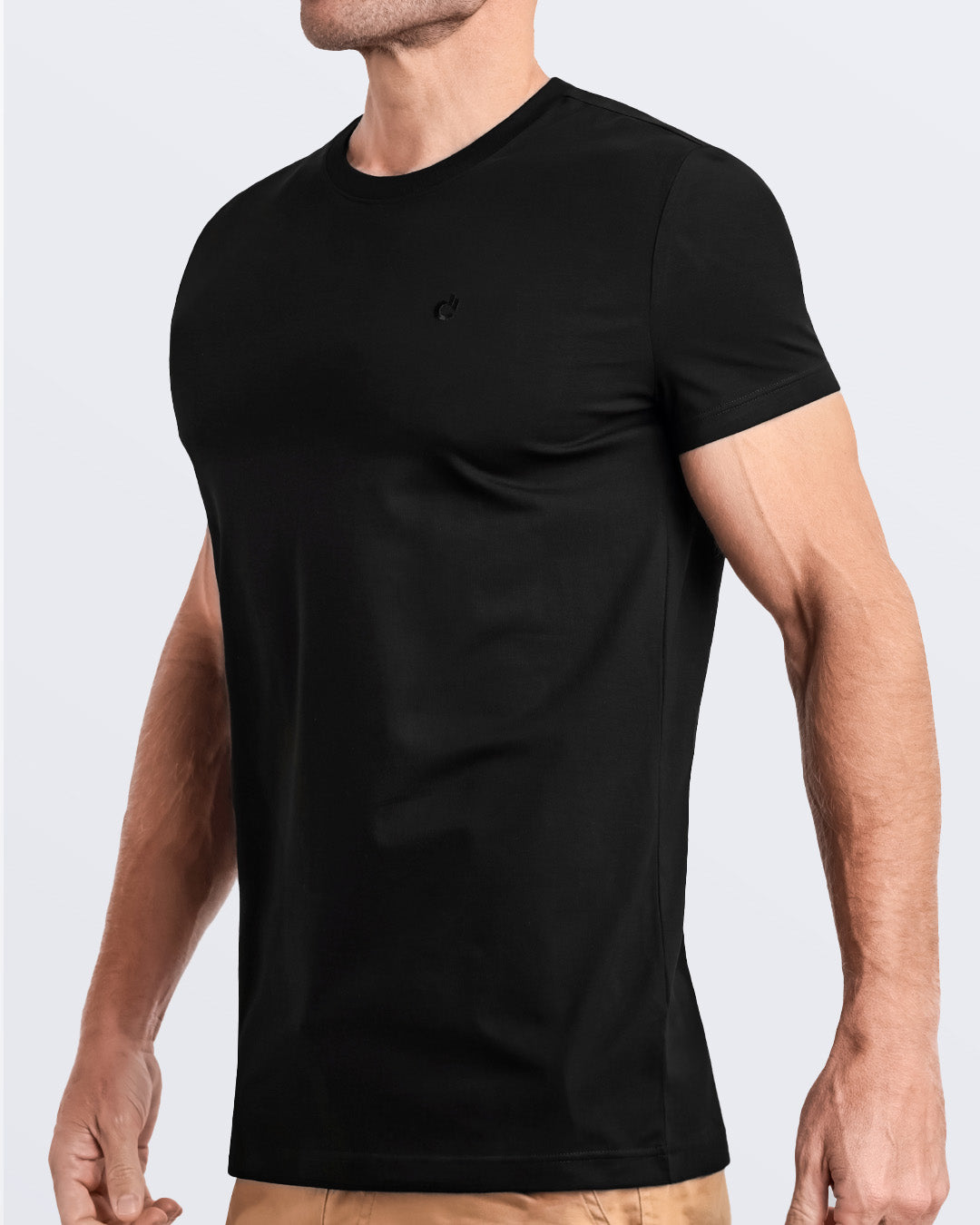 Side view of a men's premium black color modal cotton t-shirt with embroidered DC2 logo. Perfect for a modern casual look, this streetwear tee is part of the DC2 Miami men's beachwear collection, designed for comfort and style.