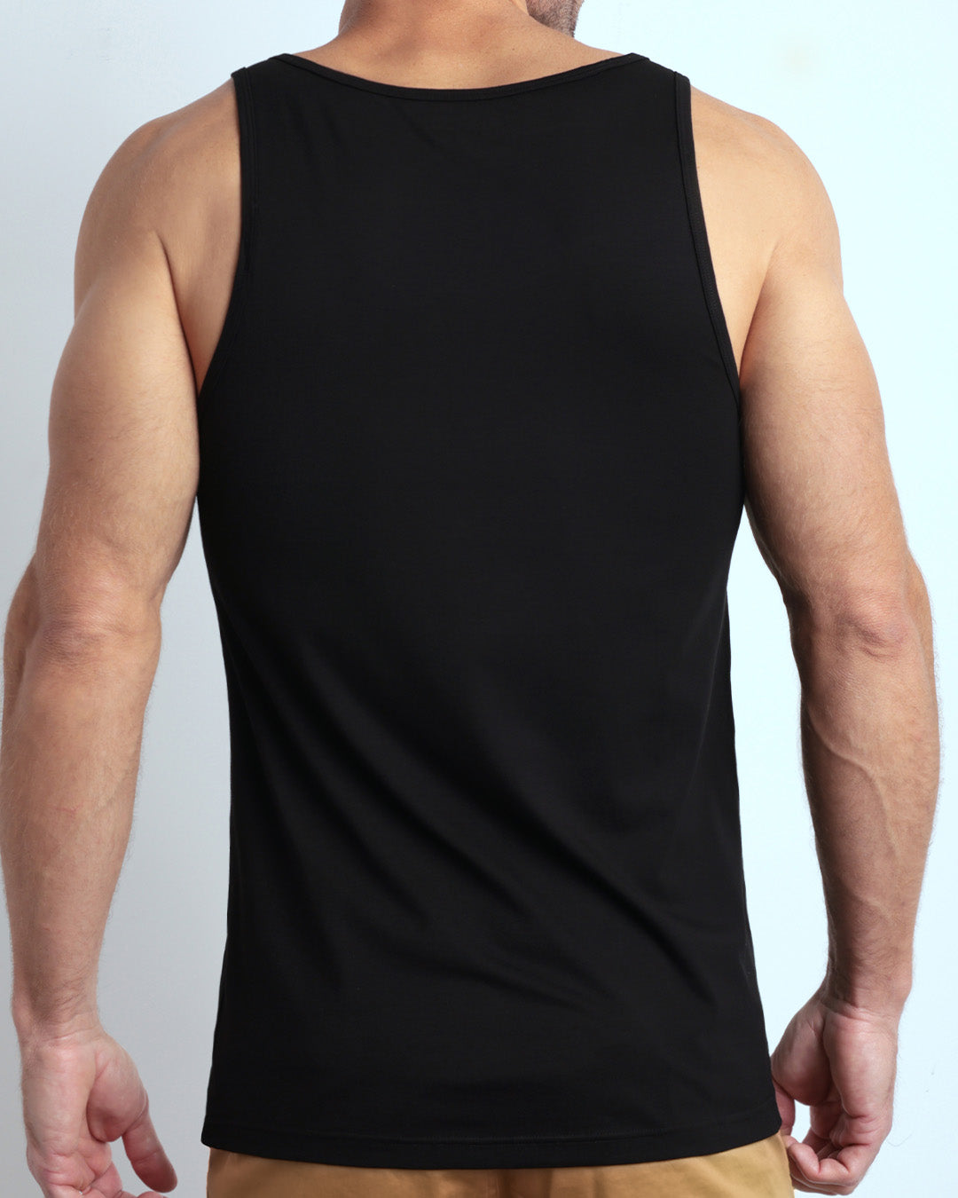 Back view of the EXACT BLACK men's fitness breathable tank top made of modal cotton blend in a solid black color by DC2 Miami menswear.