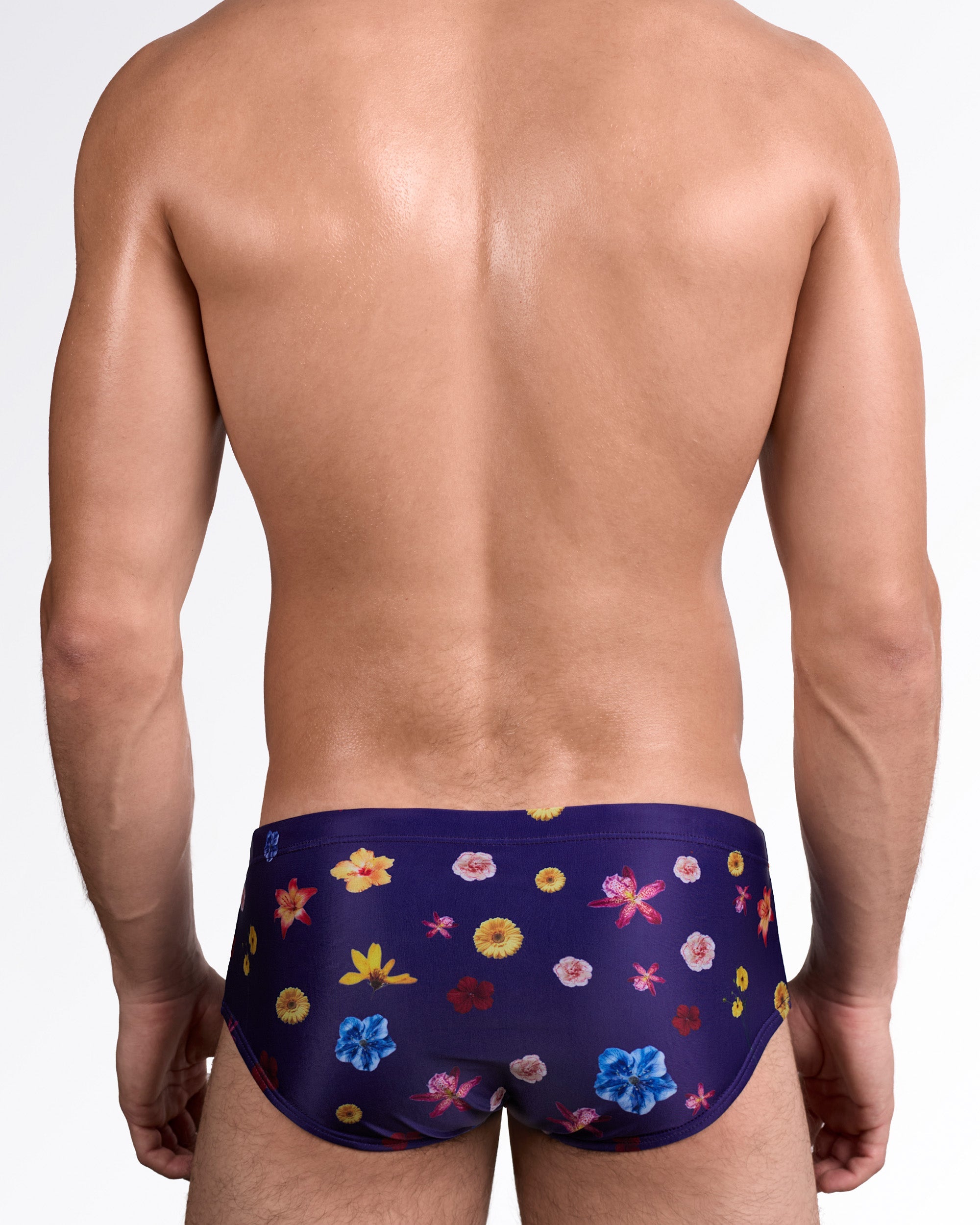 DC2 Flower Powers (Blue) Swim Sunga — back view showing full rear coverage with continuous vibrant floral pattern across the back panel.