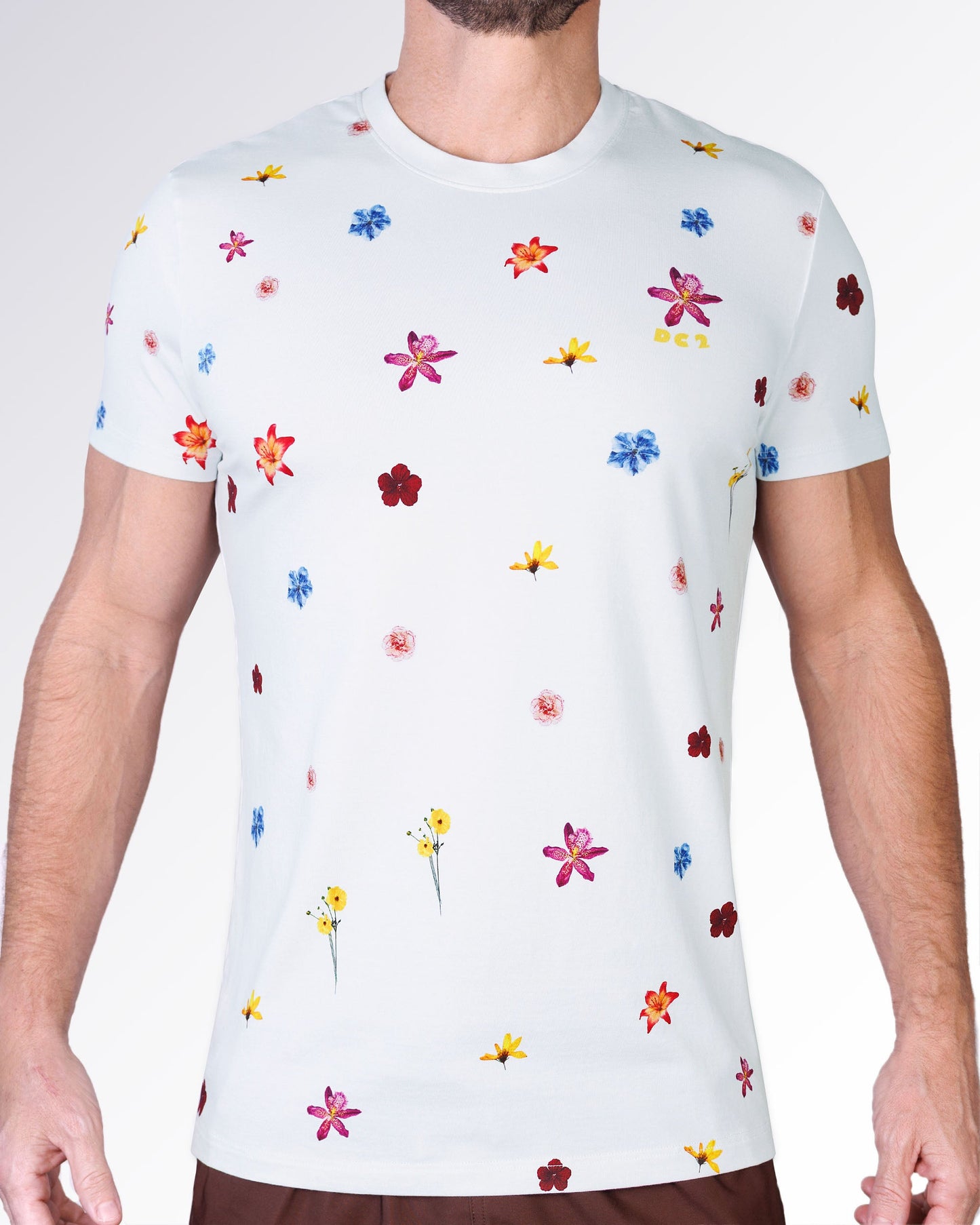 Flower Powers Cream Graphic T-Shirt by DC2 Miami featuring a cream base with scattered multicolor floral illustrations and a lightweight summer look.