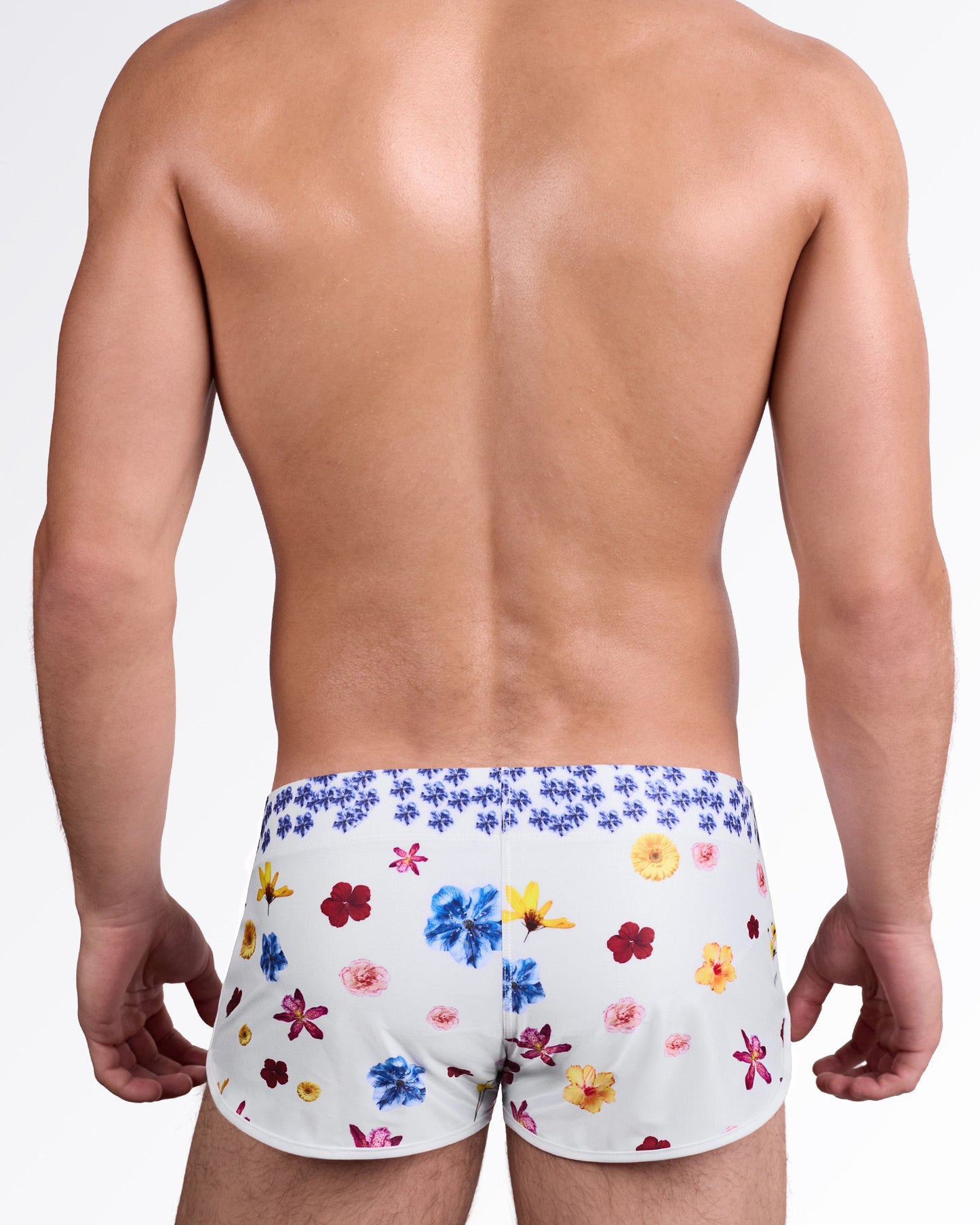 DC2 Flower Powers (Cream) Swim Shorts — back view showing allover vibrant floral placement in red, blue, yellow, and pink tones.