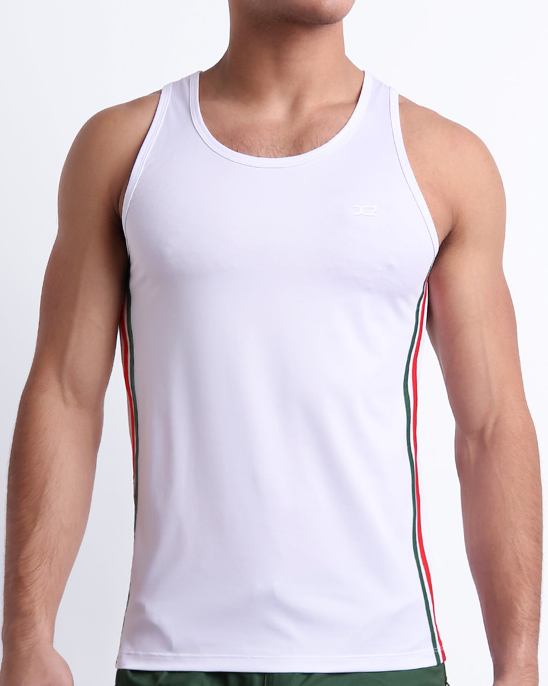 Male model wearing FORZA WHITE men’s casual Tank Top. A premium quality top in a solid white color with red and dark green stripes on the sides, a men’s beachwear brand from Miami.