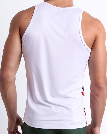 Male model wearing men’s FORZA WHITE men’s Summer Tank Top in white color with stylish green and red colored stripes. This high-quality shirt is by DC2, a men’s beachwear brand from Miami.