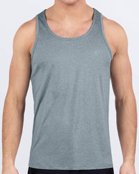 Male model wearing DC2 Grey Matters tank top in soft heather gray with minimalist DC2 logo, perfect for gym workouts, CrossFit, or beach training.