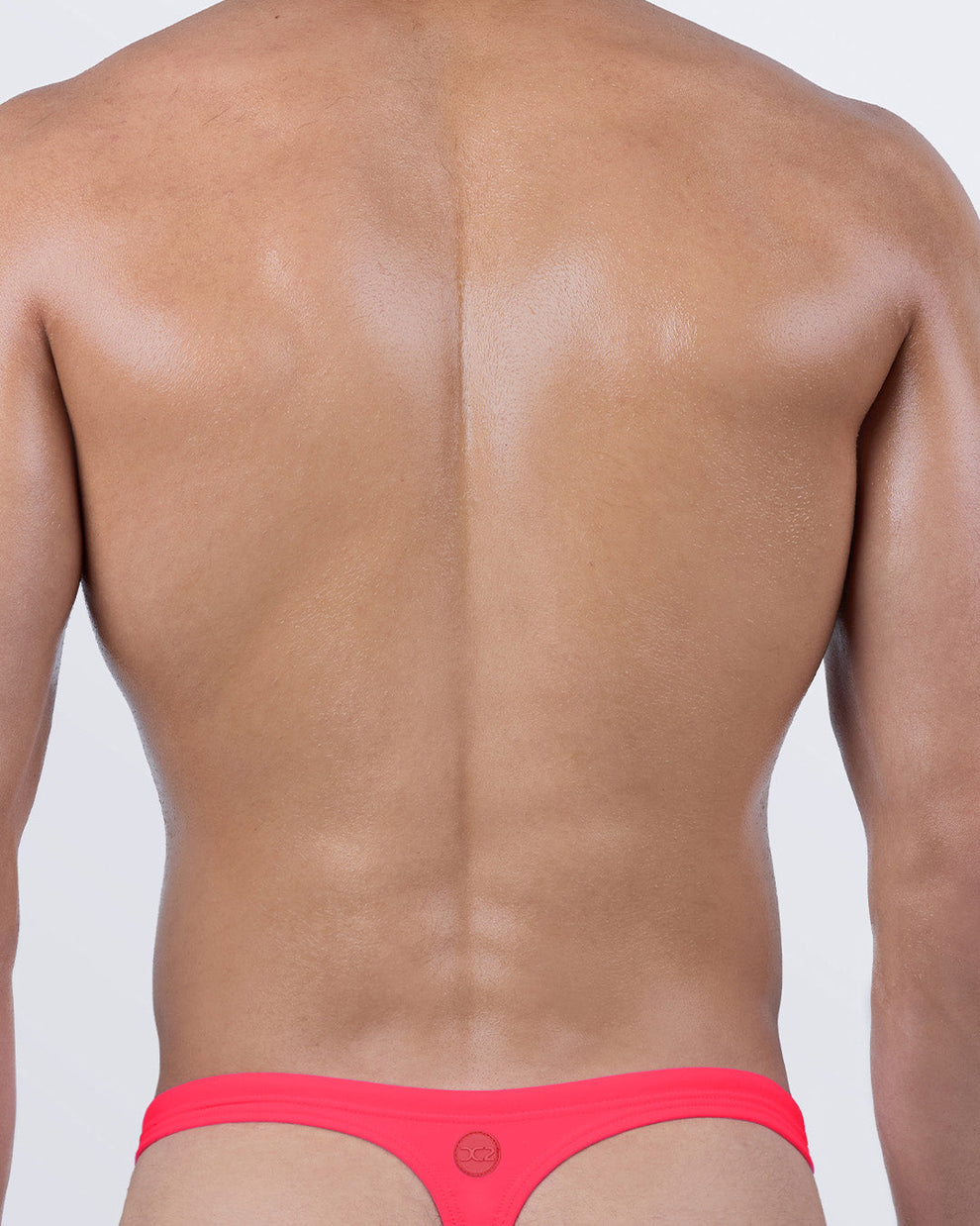 DC2 High Voltage Red Swim Thong — back view with classic “T” back design and DC2 logo for sharp, minimal tan lines.