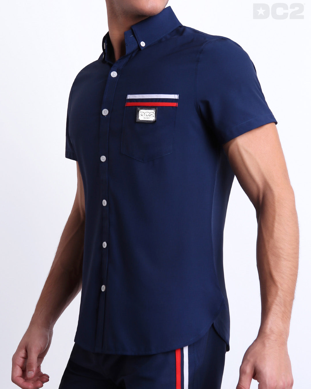 Side view of the IMPERIAL BLUE Hawaiian-inspired Stretch Shirt for men features a in a solid blue color, complete with a front pocket, made by DC2 a capsule brand by BANG! Clothes in Miami.