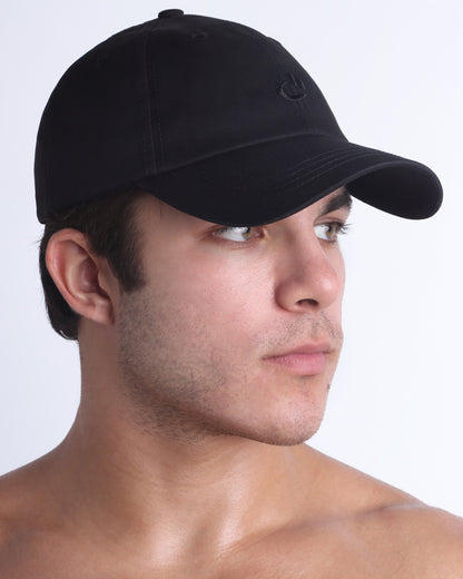 Side profile of DC2 Resort Cap in black, lightweight low-profile baseball cap designed for everyday wear.