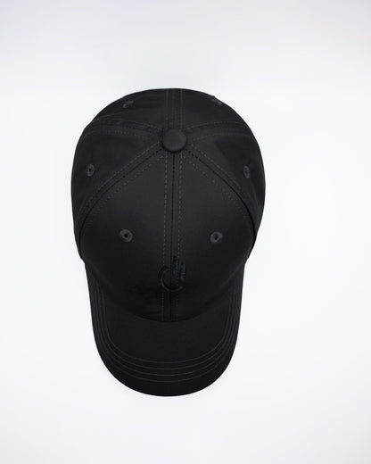 DC2 White Resort Cap — top-down view highlighting structured crown, stitched panels, and ventilation eyelets.