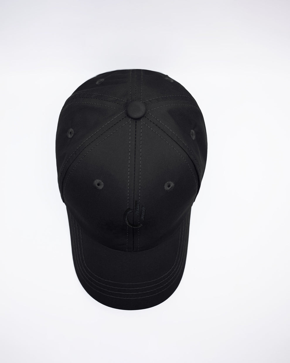 DC2 White Resort Cap — top-down view highlighting structured crown, stitched panels, and ventilation eyelets.