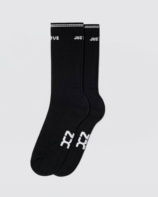 DC2 Justify My Love Ribbed Crew Socks (Black) — mid-calf socks with white DC2 logo on sole and “JUST LOVE” cuff detail.