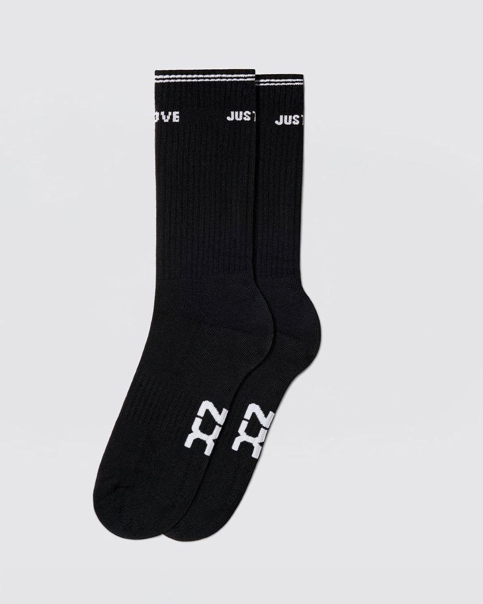 DC2 Justify My Love Ribbed Crew Socks (Black) — mid-calf socks with white DC2 logo on sole and “JUST LOVE” cuff detail.