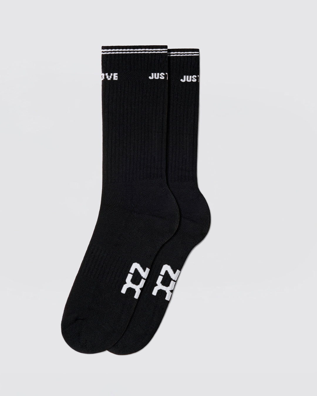DC2 Justify My Love Ribbed Crew Socks (Black) — mid-calf socks with white DC2 logo on sole and “JUST LOVE” cuff detail.
